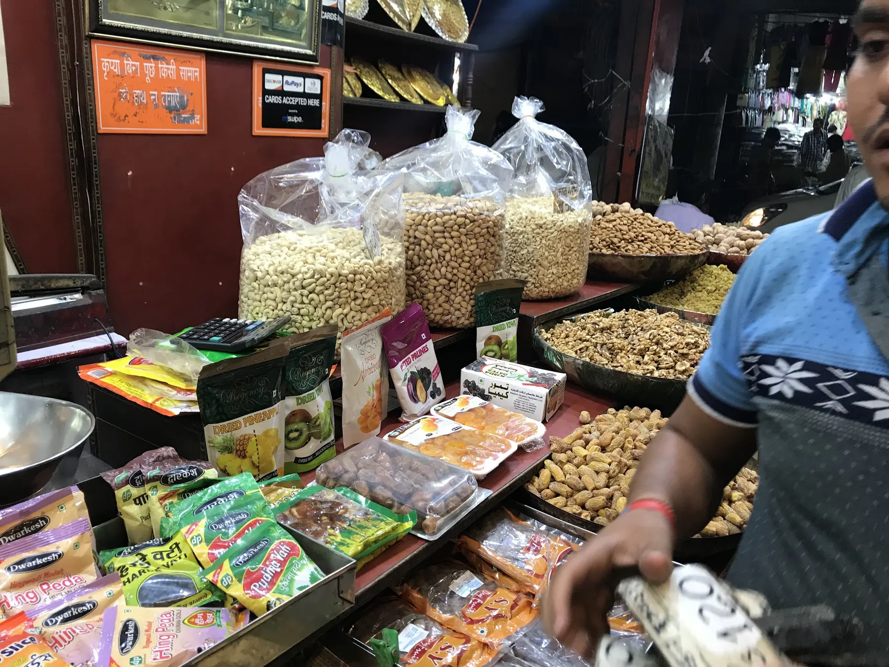 Bulk bags of cashews and dry fruits at the Sawan Dry Fruits counter in Khari Baoli