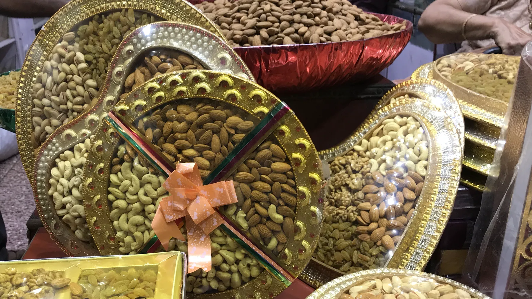 Decorated trays of almonds, cashews, pistachios and walnuts at Sawan Dry Fruits in Khari Baoli, Delhi